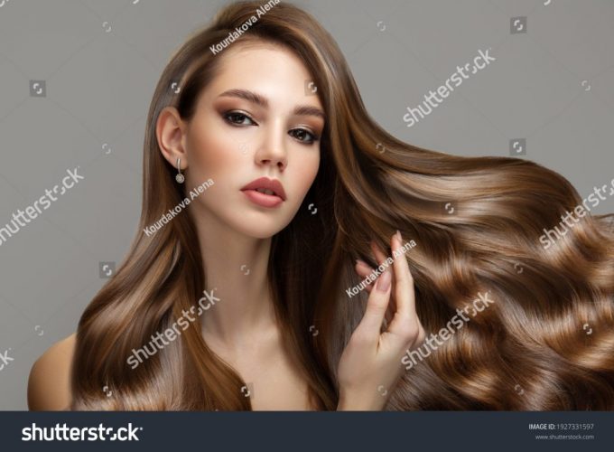 stock-photo-portrait-of-a-beautiful-brunette-woman-with-long-wavy-hair-copycpase-1927331597
