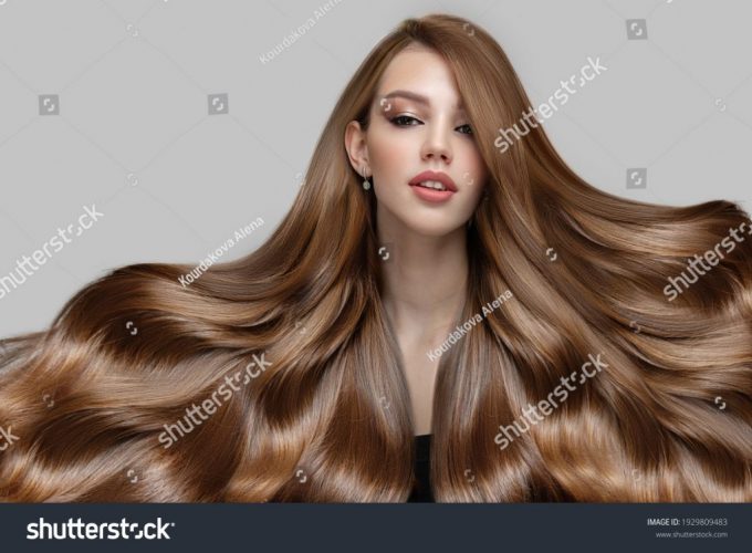 stock-photo-portrait-of-a-young-woman-with-luxurious-thick-hair-1929809483