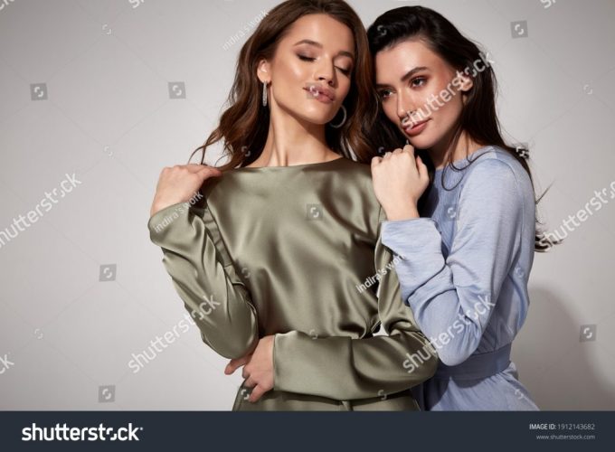 stock-photo-two-sexy-brunette-woman-luxury-lifestyle-bright-makeup-wear-natural-organic-silk-midi-dress-and-1912143682